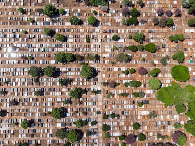 An aerial view of a neighborhood with houses, highlighting the rooftops, with a subtle overlay indicating solar panels, representing home-related tax benefits like mortgage interest and energy credits.