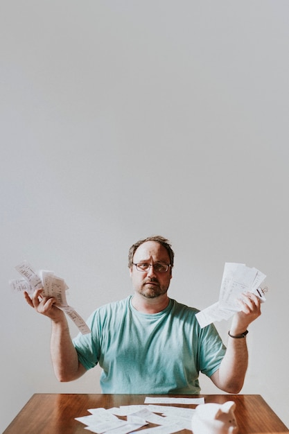 A person looking stressed while holding a stack of bills, contrasted with a peaceful image of a sunny beach in the background. The image represents the relief of having emergency savings to alleviate financial stress.