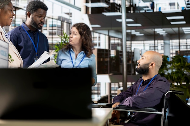 A diverse group of employees collaborating at a modern office, with a subtle overlay showing IRS compliance icons. The image represents a company culture focused on compliance and employee well-being.