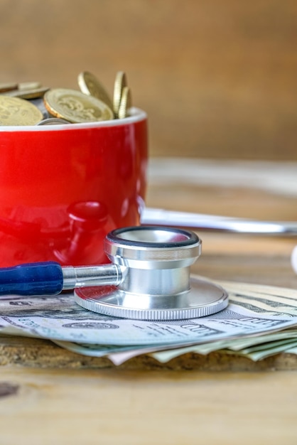A Health Savings Account (HSA) card with a stethoscope and a calculator in the background. The image represents the financial and health aspects of HSAs and the importance of compliance.
