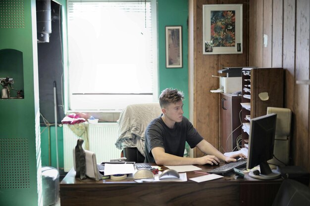 A freelancer working contently in a dedicated home office space, surrounded by organized files, a computer, and tax-related documents, highlighting the benefits of the home office deduction.