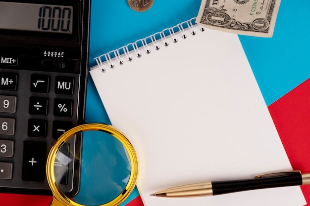 A close-up shot of tax forms with a calculator and pen on top. The focus is on the numbers and calculations, highlighting the financial aspect of education tax credits.