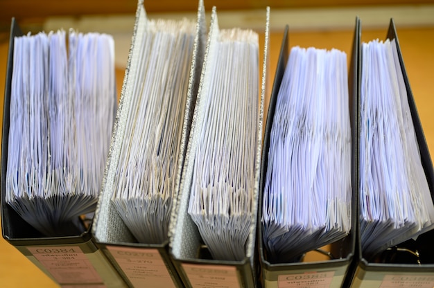 An image of a well-organized filing system, with labeled folders containing tax-related documents such as receipts, invoices, and statements, symbolizing effective tax planning.