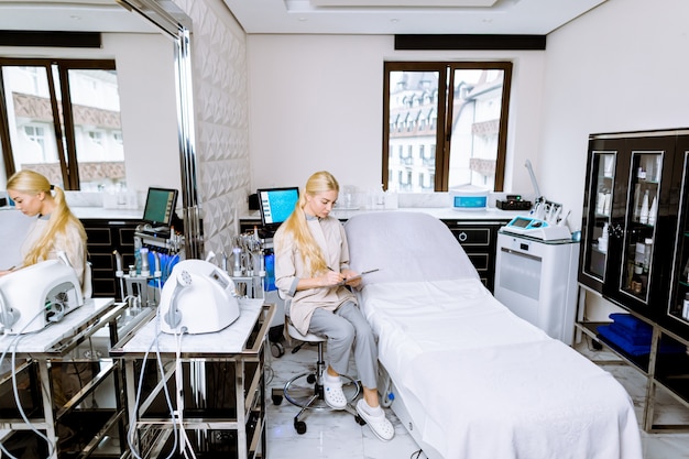 A bright and modern hospital room with advanced medical equipment, with a diverse team of doctors and nurses attending to an elderly patient. The scene is focused on demonstrating high-quality geriatric care.