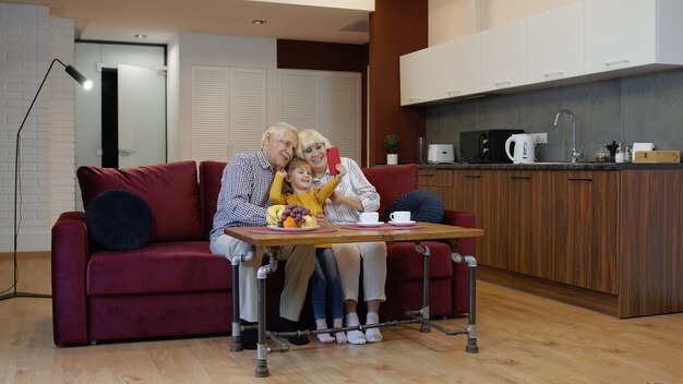 An interior shot of a modern, accessible home designed for seniors. The home features wide doorways, grab bars in the bathroom, a comfortable living room with adaptive furniture, and soft, natural lighting.