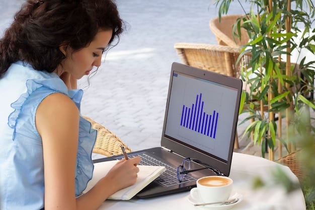 A person using a laptop, researching salary data on a website. The website displays charts and graphs related to salary ranges for different job titles. The person is focused and taking notes.