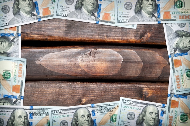 A photograph representing salary negotiation with a background with dollar bills.