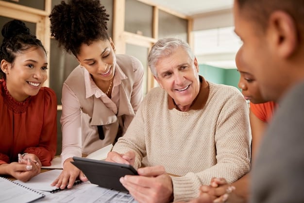 A group of diverse workers smiling and gathered around a tablet displaying information about their company's retirement plan. The image conveys teamwork and financial education.
