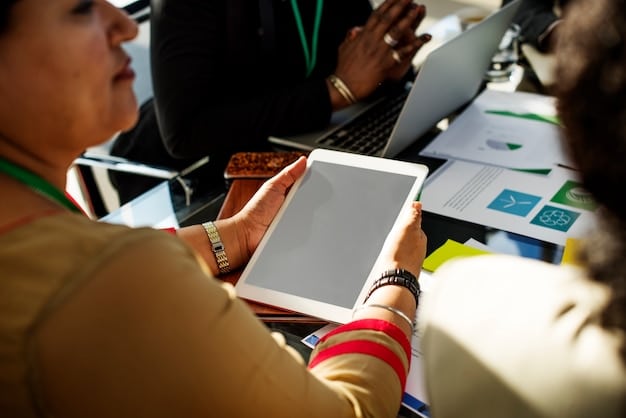 An employee interacting with an interactive benefits guide on a tablet, showcasing how technology can enhance benefits communication and make the process more engaging.