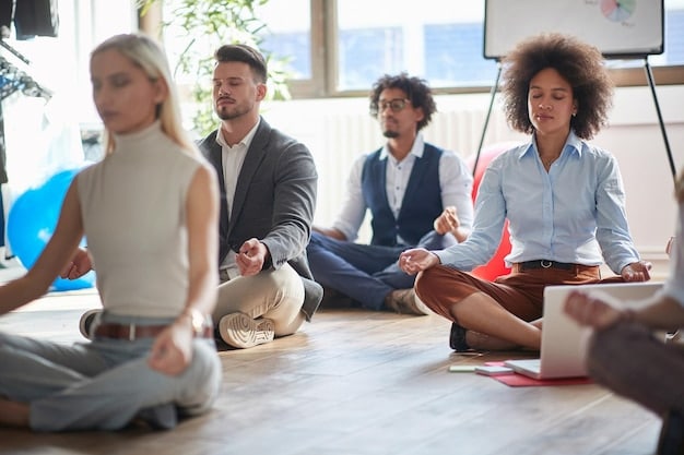 Employees in a brightly lit office participating in a group yoga session. The image conveys a sense of calm and focus, highlighting the importance of mental wellness in the workplace.