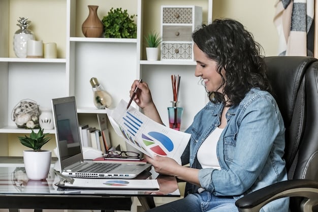 An employee is sitting at a desk using a laptop with a graph on the screen. The graph shows positive trends in employee satisfaction and productivity after implementing a new benefits program. The office environment is modern and comfortable.