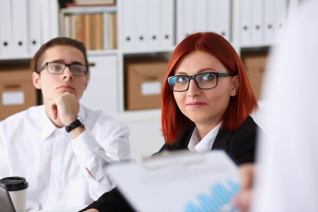 An office scene showing a meeting with an audit team. The inspector, a stern-faced woman in glasses, is scrutinizing a document while two nervous, but polite, company representatives look on.