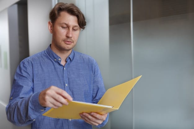 A close-up of an employee reviewing a document titled 