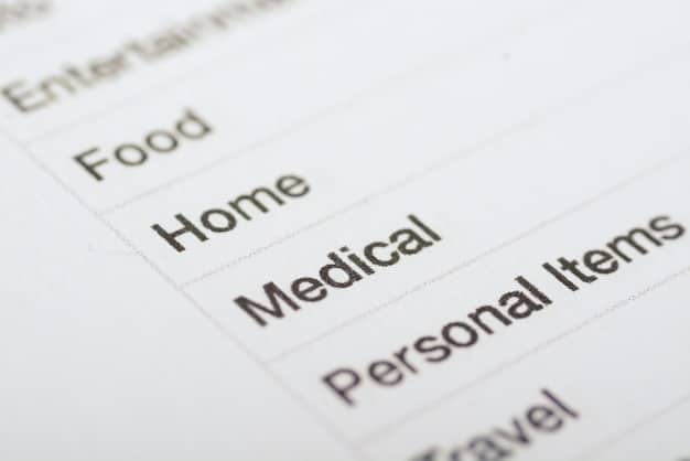 A close-up shot of a benefits statement document, with various sections highlighted, such as health insurance, retirement plans, and PTO.