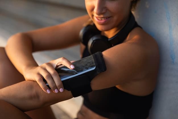 Close-up of an employee using a fitness tracker on their wrist, highlighting the use of technology in wellness programs to monitor activity levels and progress towards health goals.