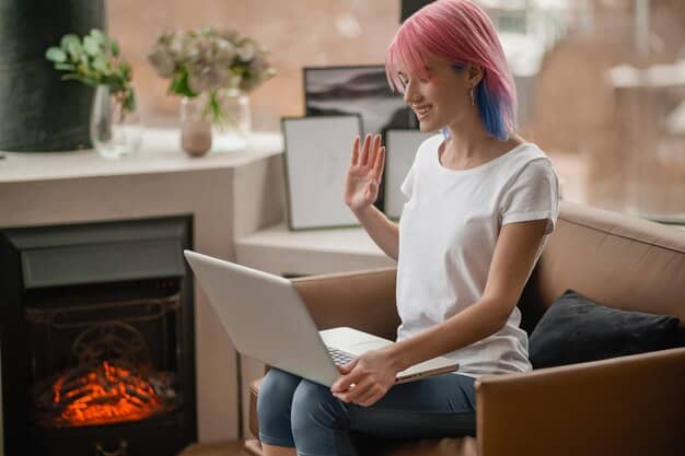 A person sitting comfortably at their desk, participating in a virtual mindfulness session on their laptop, showcasing the accessibility and convenience of virtual wellness programs.