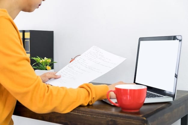 A person filling out an application form on a desk, with a pen in hand and a laptop nearby. The scene implies careful paperwork and planning related to educational expenses.