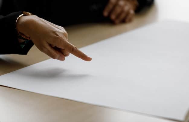 A close-up of a hand pointing to a specific section within a Summary Plan Description, highlighting 