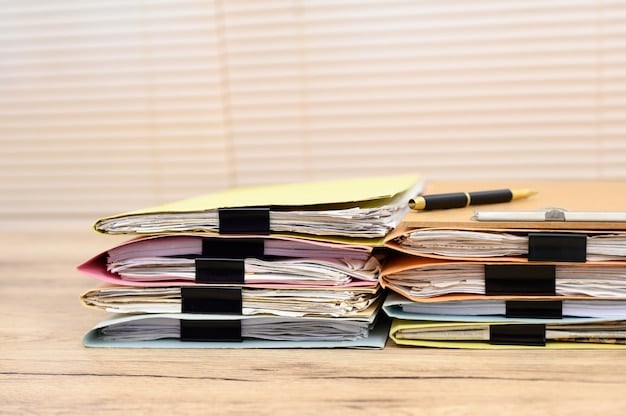 A close-up shot of various receipts and invoices neatly organized in a folder, representing business expenses.