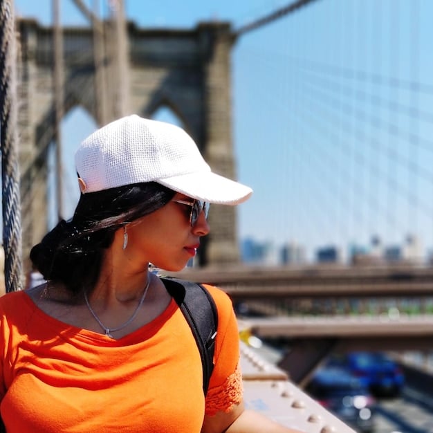 A close-up of construction workers building a bridge, emphasizing the job creation aspect of the Infrastructure Investment and Jobs Act. The workers are wearing hard hats and safety vests.